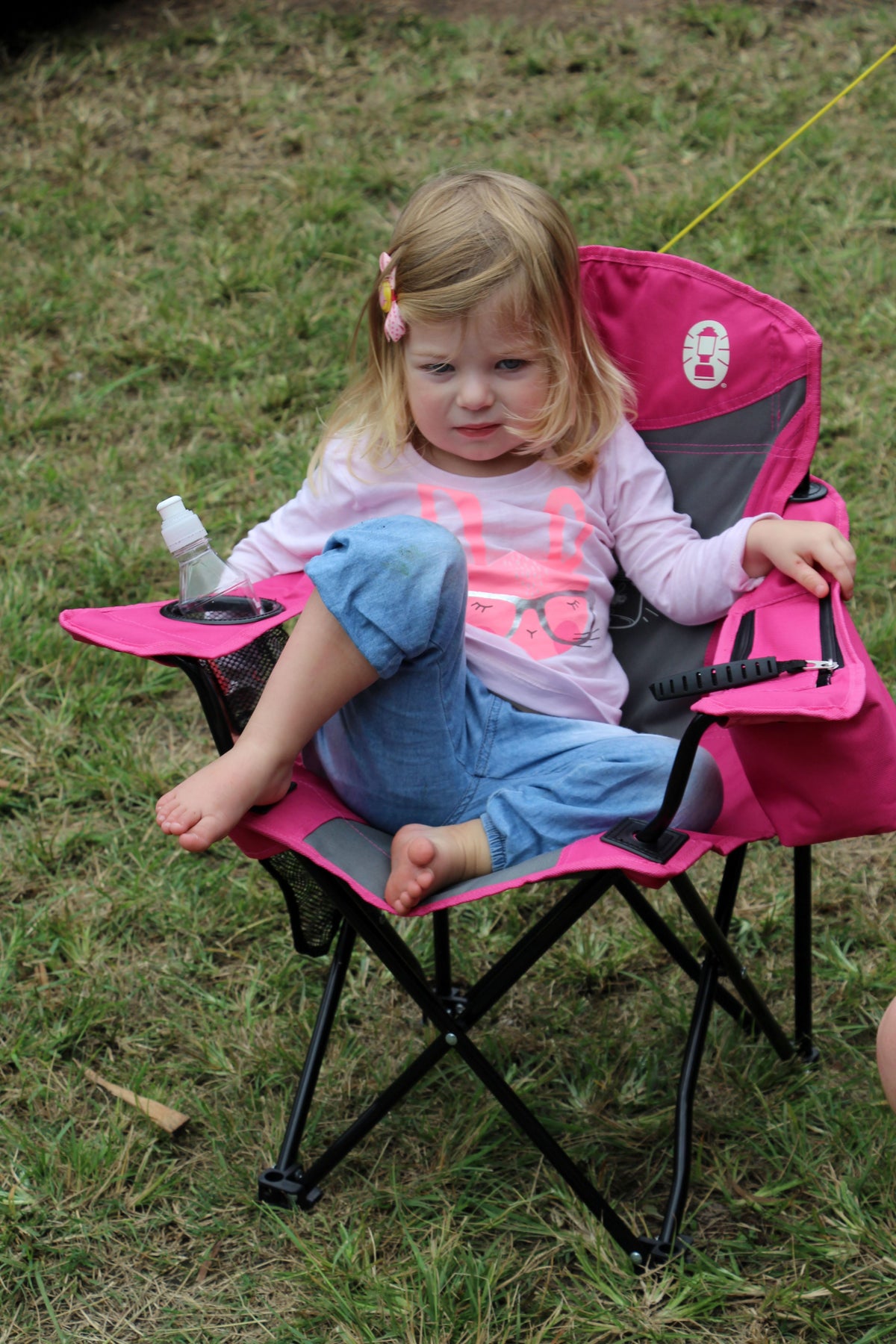 COLEMAN ™ Fyrefly Pink Kids Chair, Glow in the Dark, Padded Back Rest, Foldable, Locking Frame, Insulated Arm Cooler, Mesh Drink Holder, Storage Pocket, Compact Quad Design, 600D Polyester, Carry Bag with Shoulder Strap